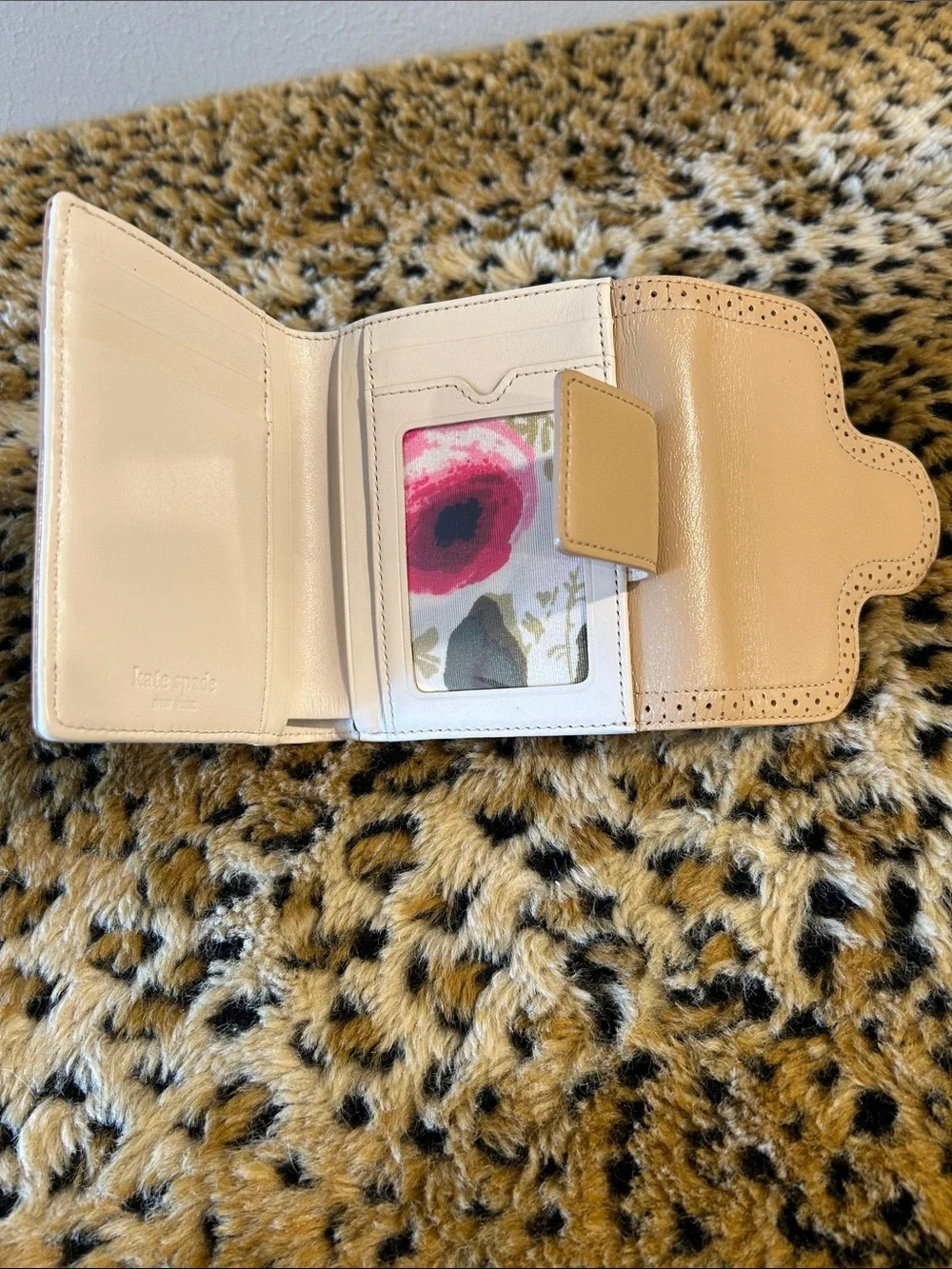 kate spade cream perforated leather bifold wallet